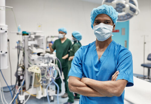 Portrait of Male Surgical Nurse Standing in Operating Room
